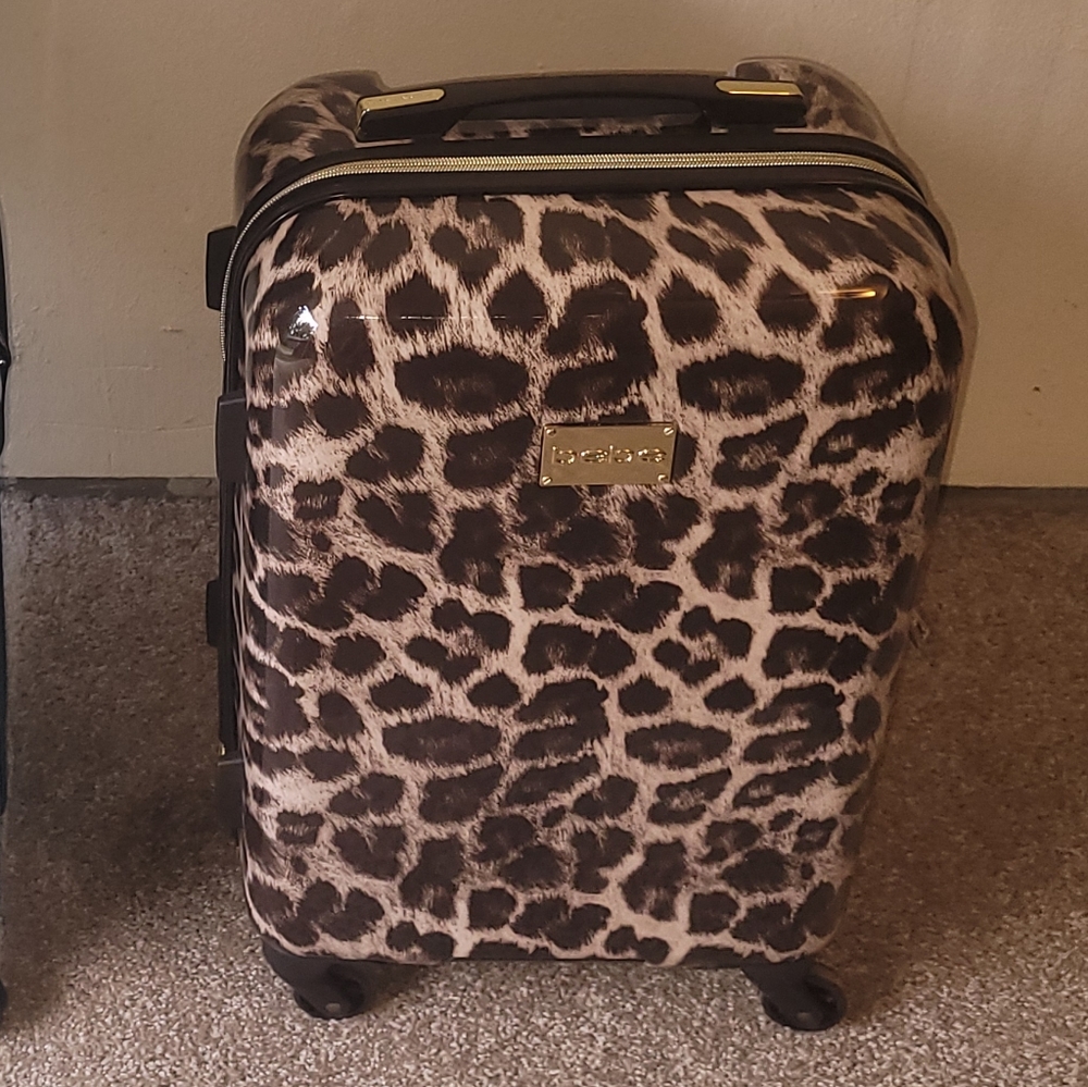 Bebe cheetah print small suitcase .
